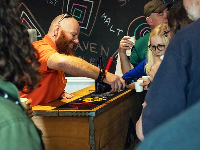 a group of people sitting at a table