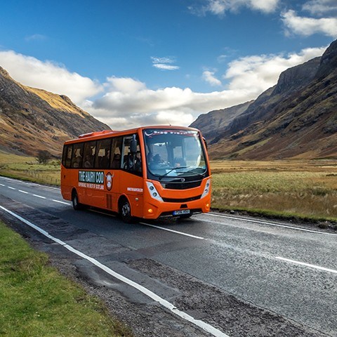 A Hairy Coo coach in the Scottish Highlands