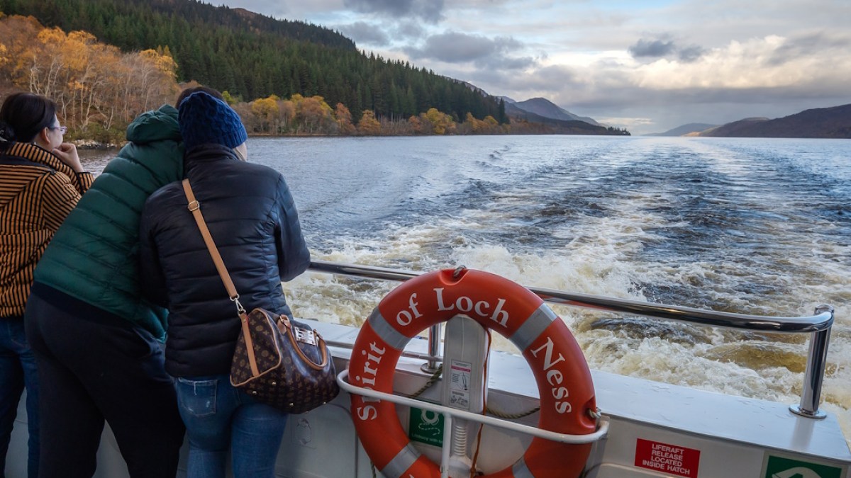 Hairy Coo tour visitors enjoying the Loch Ness boat tour